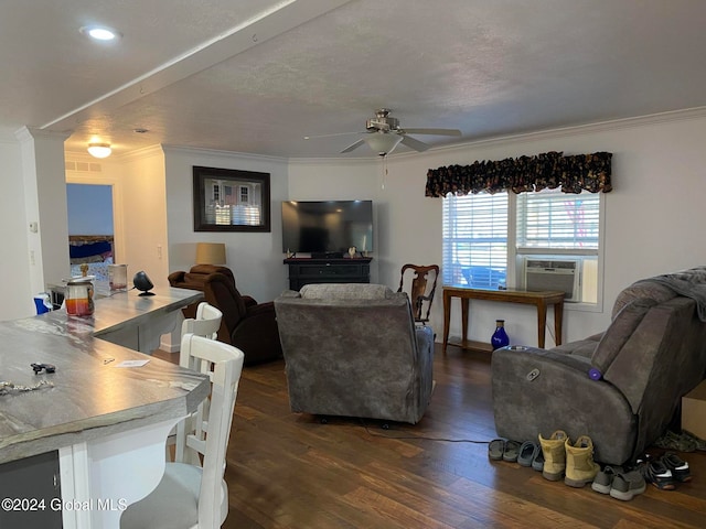 living room featuring dark wood-type flooring, cooling unit, crown molding, a textured ceiling, and ceiling fan