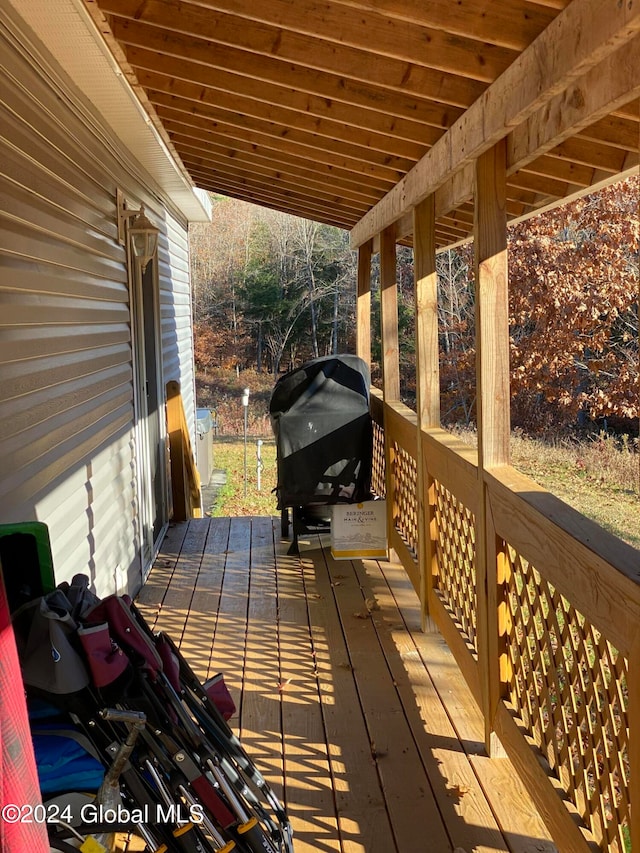 wooden deck featuring grilling area