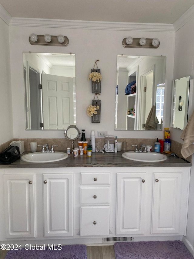 bathroom with vanity and crown molding