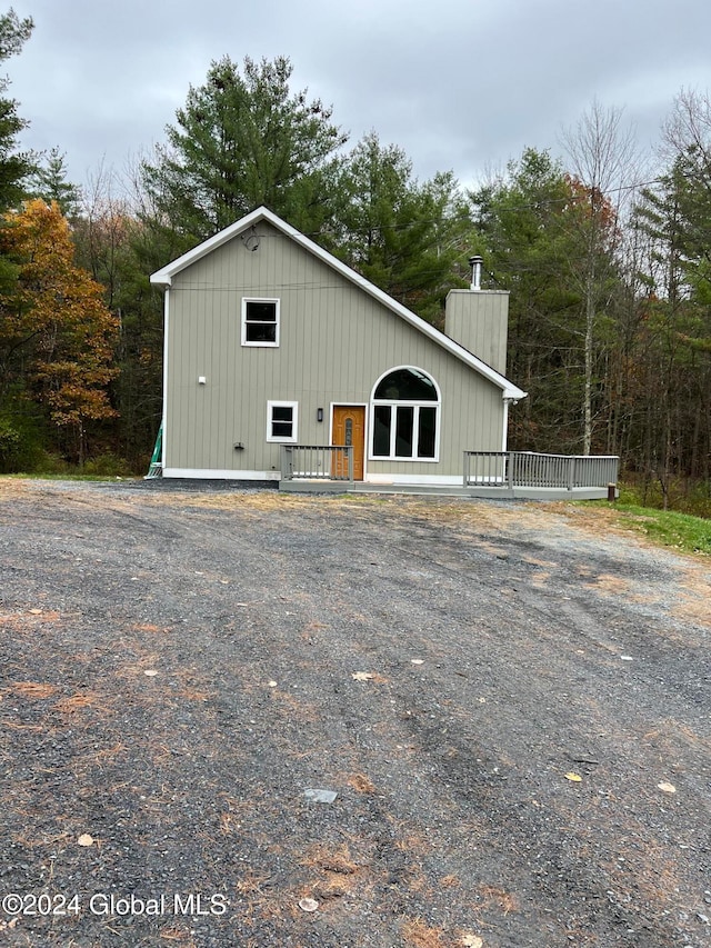 view of front facade with a wooden deck