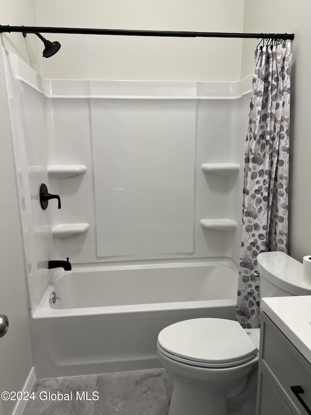 full bathroom featuring shower / bath combination with curtain, toilet, and vanity