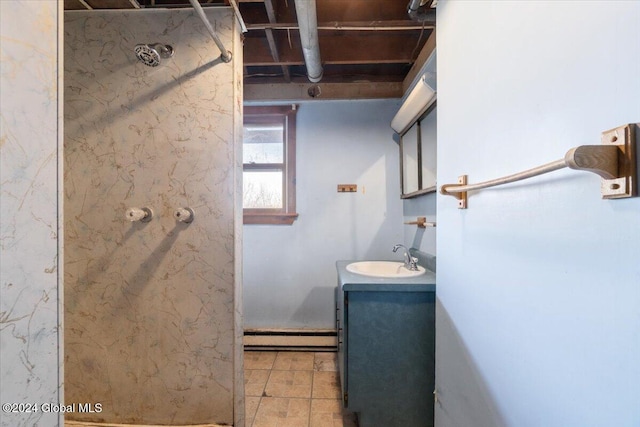 bathroom with vanity and a baseboard heating unit