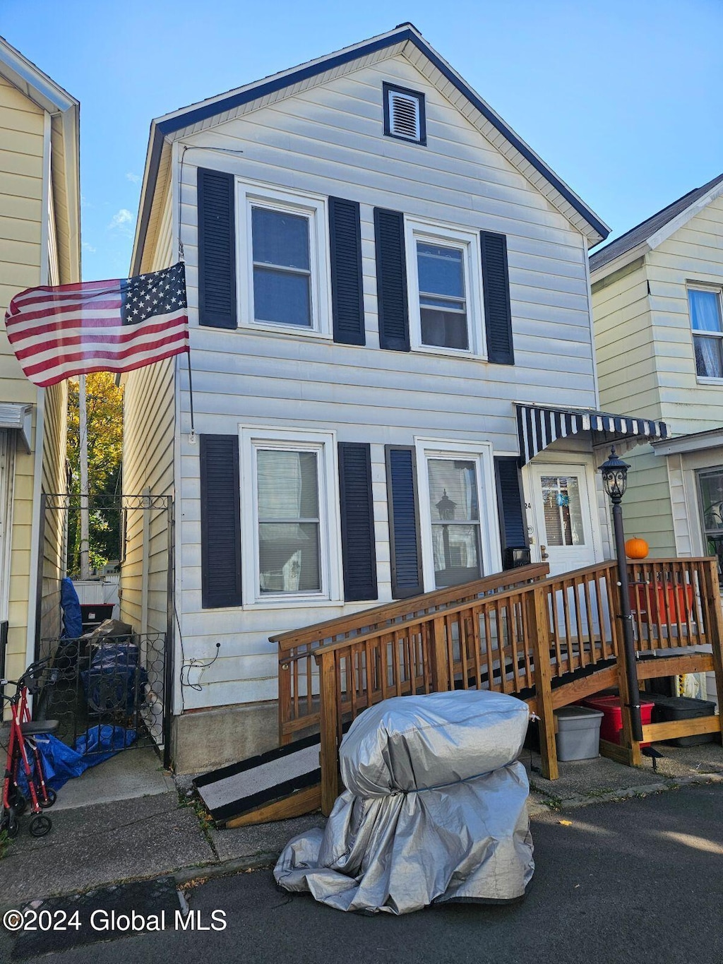 back of property featuring a wooden deck