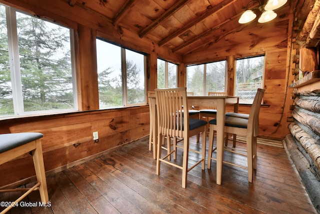 sunroom with wood ceiling and lofted ceiling with beams