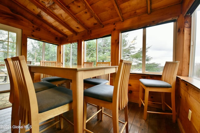 sunroom / solarium with wooden ceiling, vaulted ceiling, and a wealth of natural light