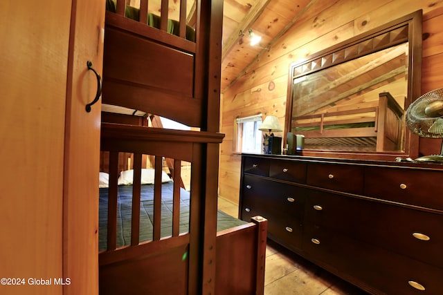 interior space with wooden walls, vaulted ceiling, and wooden ceiling