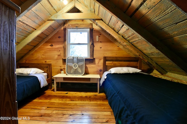 bedroom with wood ceiling, lofted ceiling, and hardwood / wood-style floors