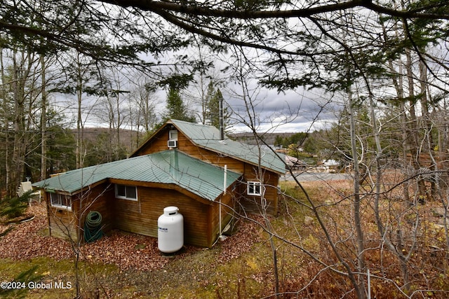 view of side of property featuring central AC