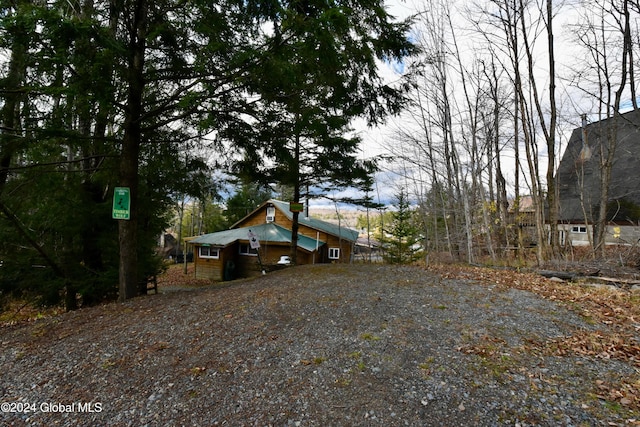 2 Mountain St, Greenfield, NY 12850 - view of side of home featuring gravel driveway