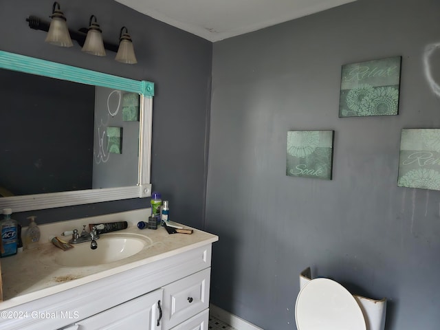 bathroom with vanity and toilet