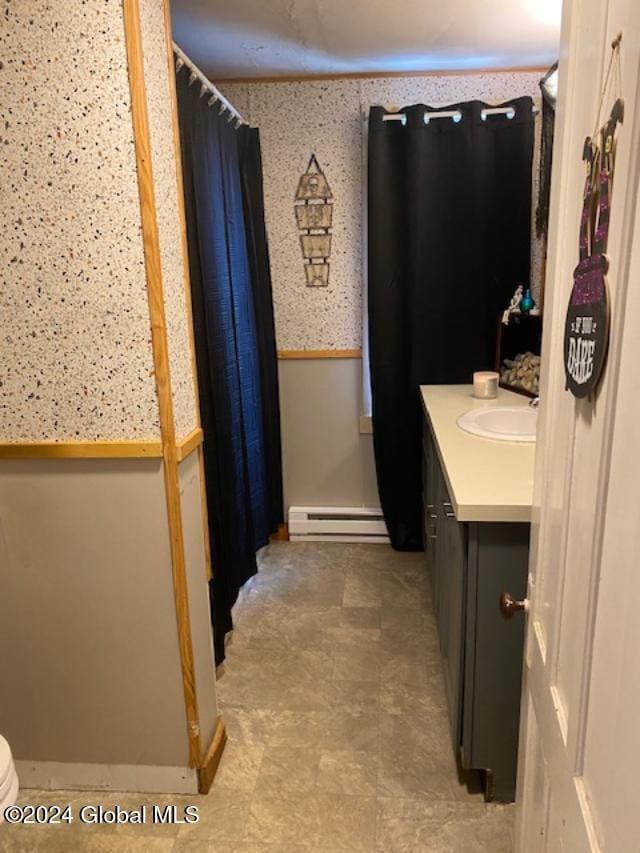 bathroom with baseboard heating, vanity, a shower with curtain, and toilet