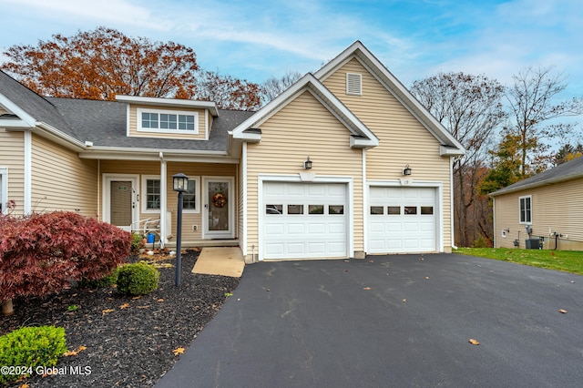 view of front property featuring a porch and cooling unit