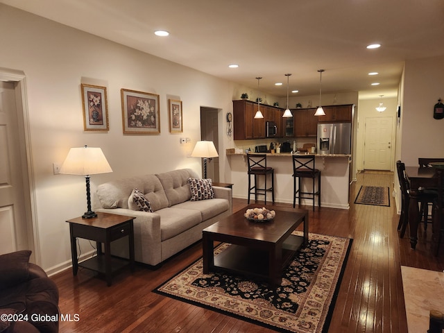 living room with dark wood-type flooring