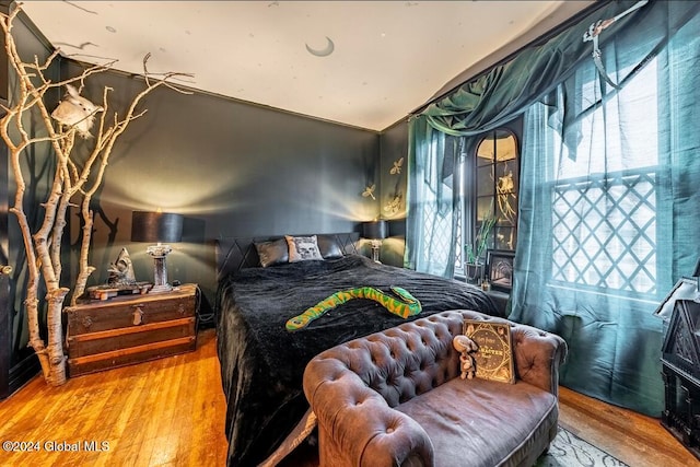 bedroom with wood-type flooring