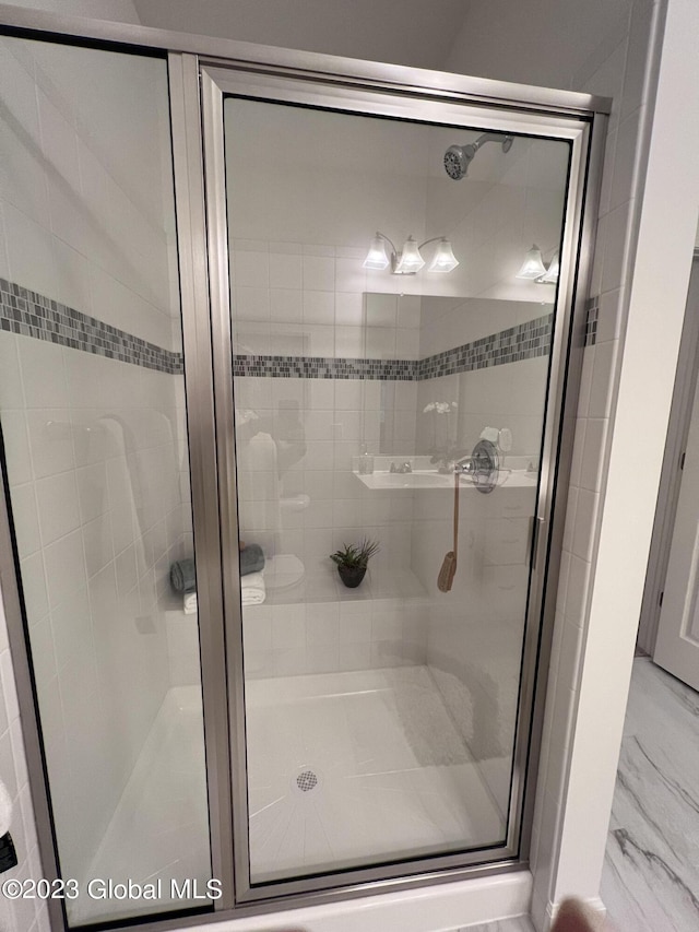 full bathroom with a shower stall
