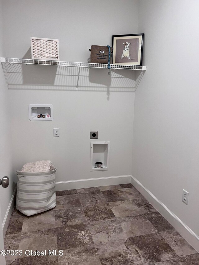 washroom with hookup for an electric dryer and washer hookup