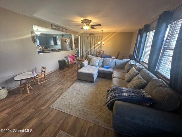 living room featuring hardwood / wood-style flooring and ceiling fan