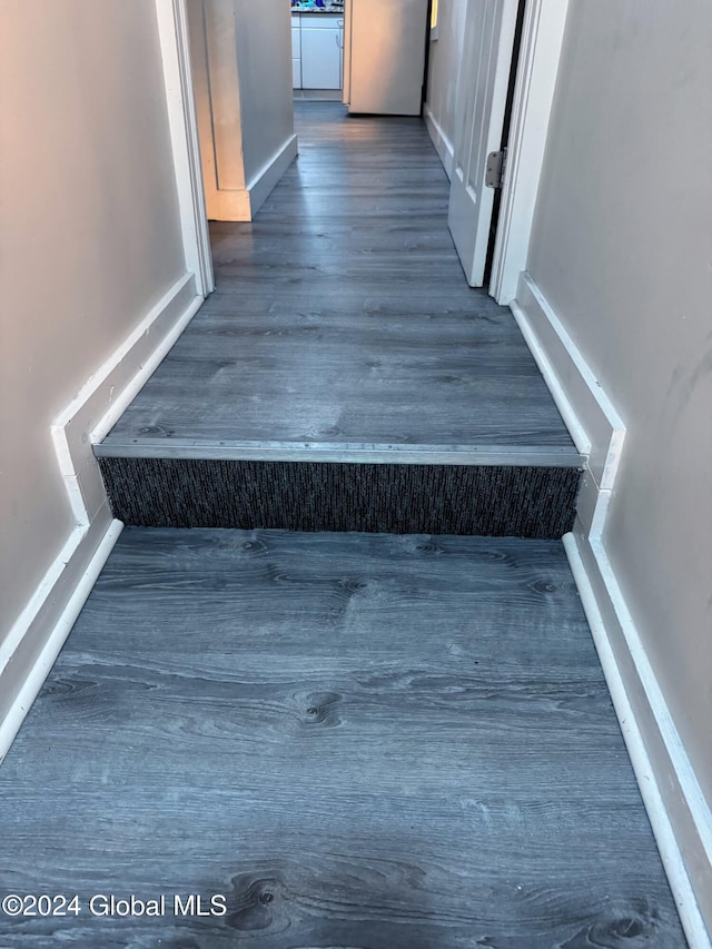 stairs with wood-type flooring