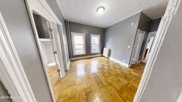 hall featuring radiator and light parquet floors