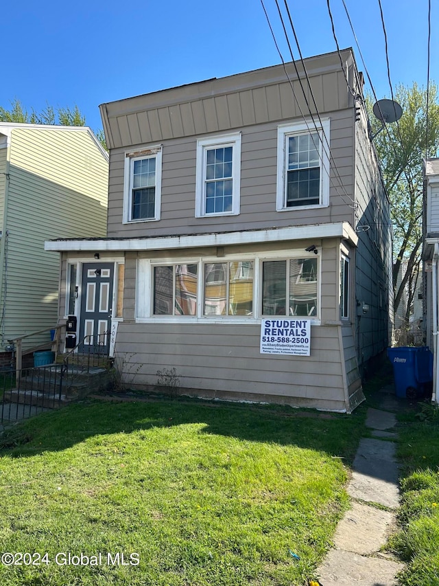 view of property with a front lawn