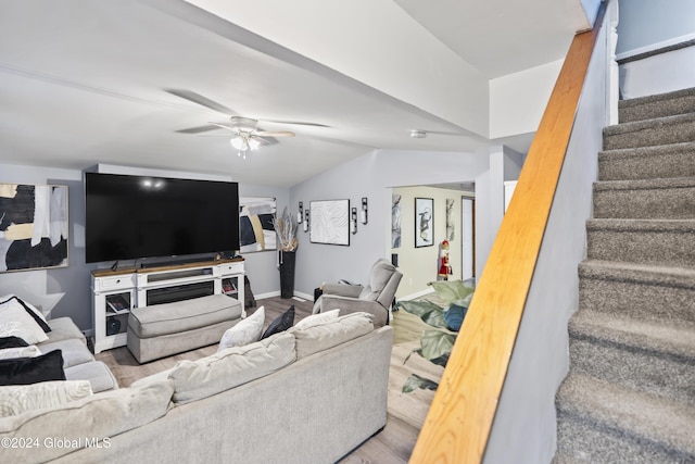 living room with wood-type flooring, vaulted ceiling, and ceiling fan