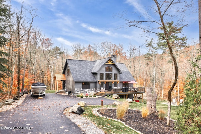 view of front of property featuring a wooden deck