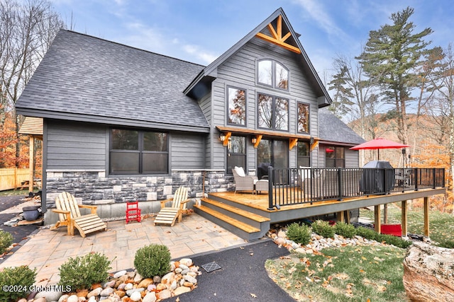 view of front of house with a patio and a deck