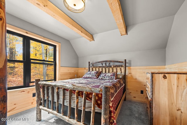 bedroom featuring wood walls, carpet floors, and lofted ceiling with beams