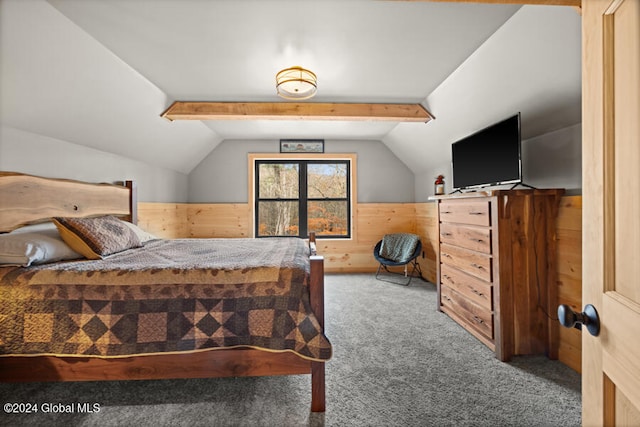 carpeted bedroom with lofted ceiling with beams and wooden walls