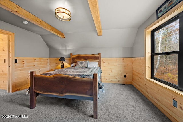 bedroom featuring carpet, lofted ceiling with beams, and wood walls