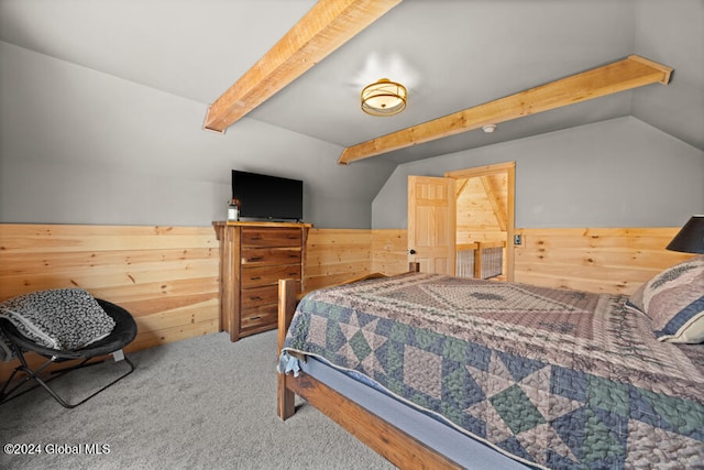 bedroom featuring carpet floors, lofted ceiling with beams, and wooden walls