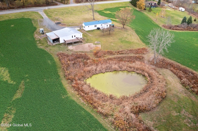 birds eye view of property with a rural view and a water view