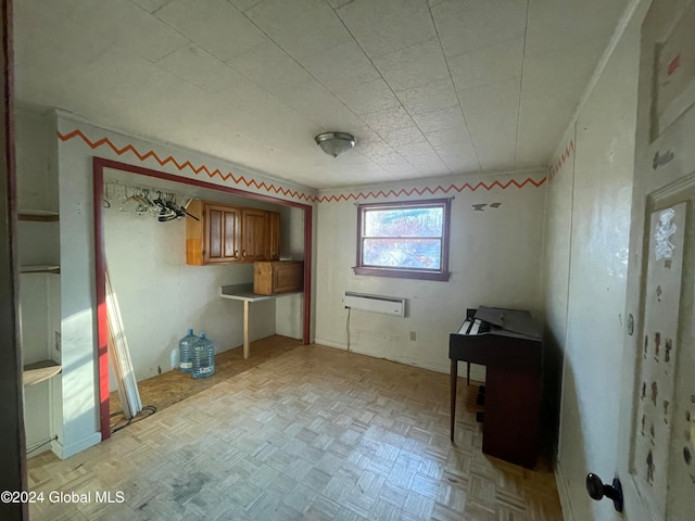 interior space featuring an AC wall unit and light parquet floors