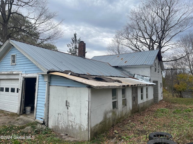 view of side of property featuring a garage