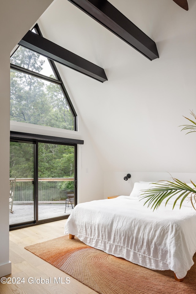 bedroom featuring access to outside, light hardwood / wood-style floors, beam ceiling, and high vaulted ceiling