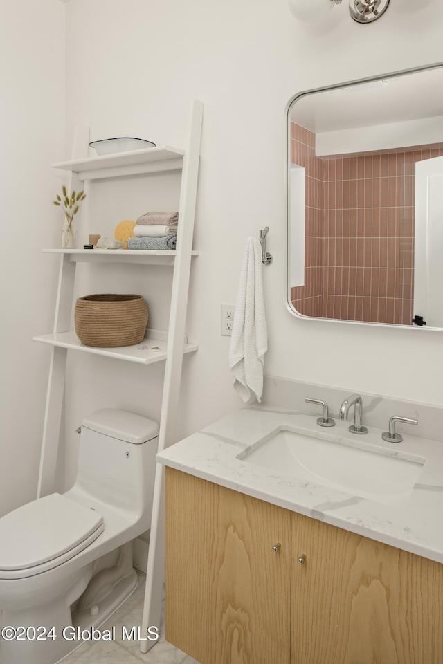 bathroom with toilet and vanity