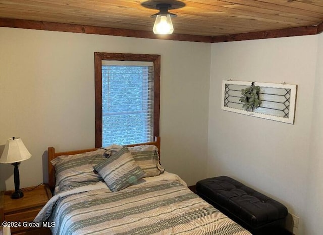 bedroom with wood-type flooring and wood ceiling