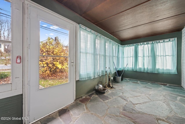 unfurnished sunroom featuring a healthy amount of sunlight