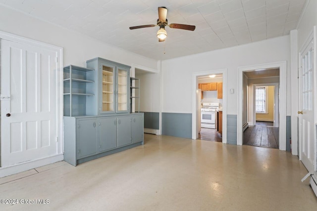 spare room featuring ceiling fan and crown molding