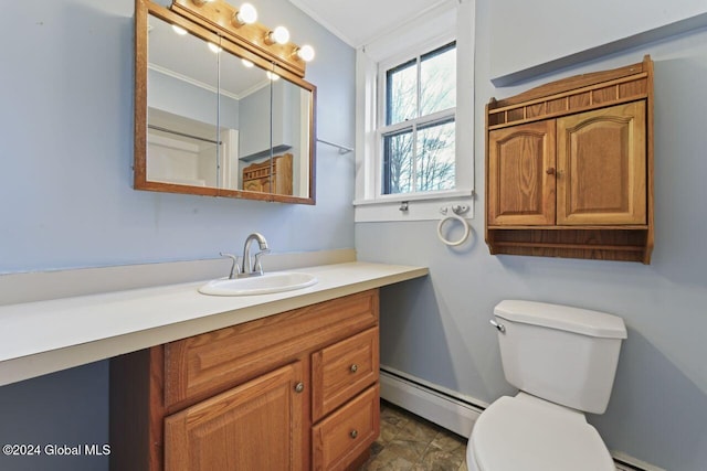 bathroom with baseboard heating, toilet, vanity, and ornamental molding