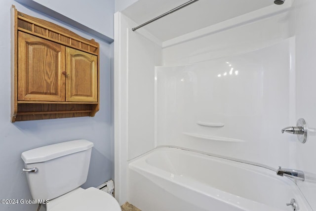 bathroom featuring shower / tub combination, toilet, and a baseboard heating unit