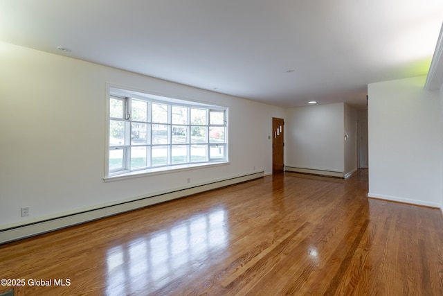1258 Hawthorn Rd, Niskayuna, NY 12309 - empty room with baseboard heating, wood finished floors, baseboards, and recessed lighting