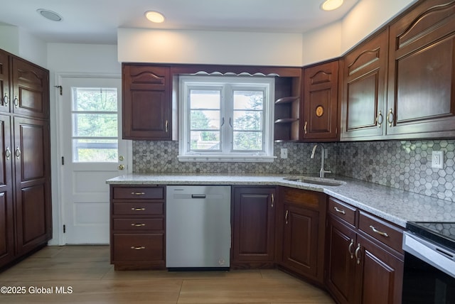 1258 Hawthorn Rd, Niskayuna, NY 12309 - kitchen featuring dishwasher, a sink, backsplash, light stone countertops, and recessed lighting