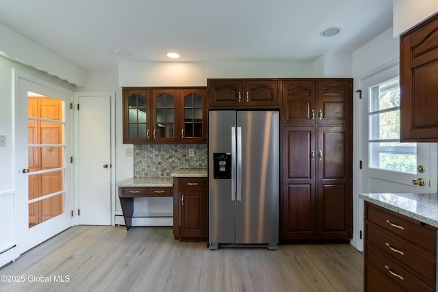 1258 Hawthorn Rd, Niskayuna, NY 12309 - kitchen with stainless steel fridge with ice dispenser, glass insert cabinets, a baseboard radiator, light wood finished floors, and backsplash