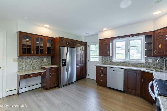 1258 Hawthorn Rd, Niskayuna, NY 12309 - kitchen featuring stainless steel refrigerator with ice dispenser, dishwasher, a baseboard radiator, a sink, and electric stove