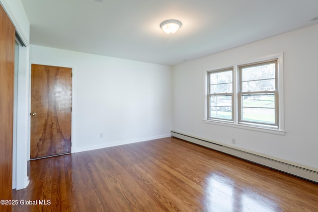 1258 Hawthorn Rd, Niskayuna, NY 12309 - unfurnished room featuring a baseboard radiator, wood finished floors, and baseboards