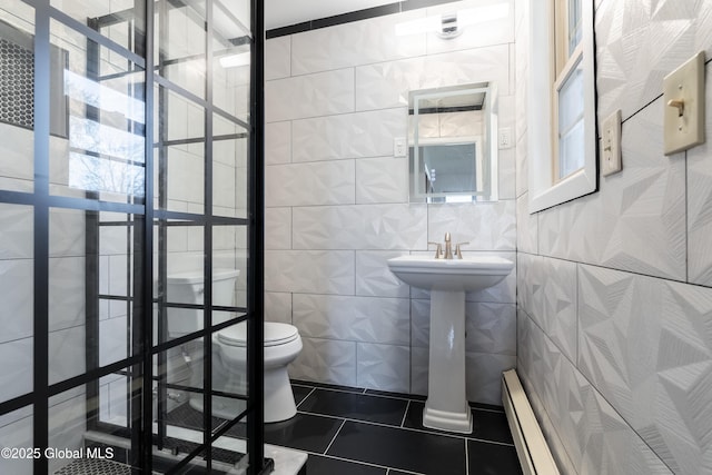 1258 Hawthorn Rd, Niskayuna, NY 12309 - bathroom with toilet, tile patterned flooring, baseboard heating, tile walls, and a sink