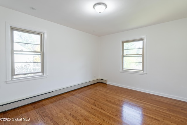 1258 Hawthorn Rd, Niskayuna, NY 12309 - spare room with a baseboard radiator, wood finished floors, and baseboards