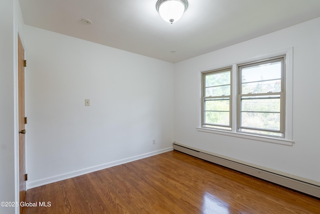 1258 Hawthorn Rd, Niskayuna, NY 12309 - unfurnished room with a baseboard radiator, wood finished floors, and baseboards