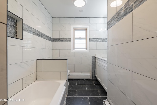 1258 Hawthorn Rd, Niskayuna, NY 12309 - full bathroom featuring baseboard heating, toilet, a tub to relax in, vanity, and tile walls